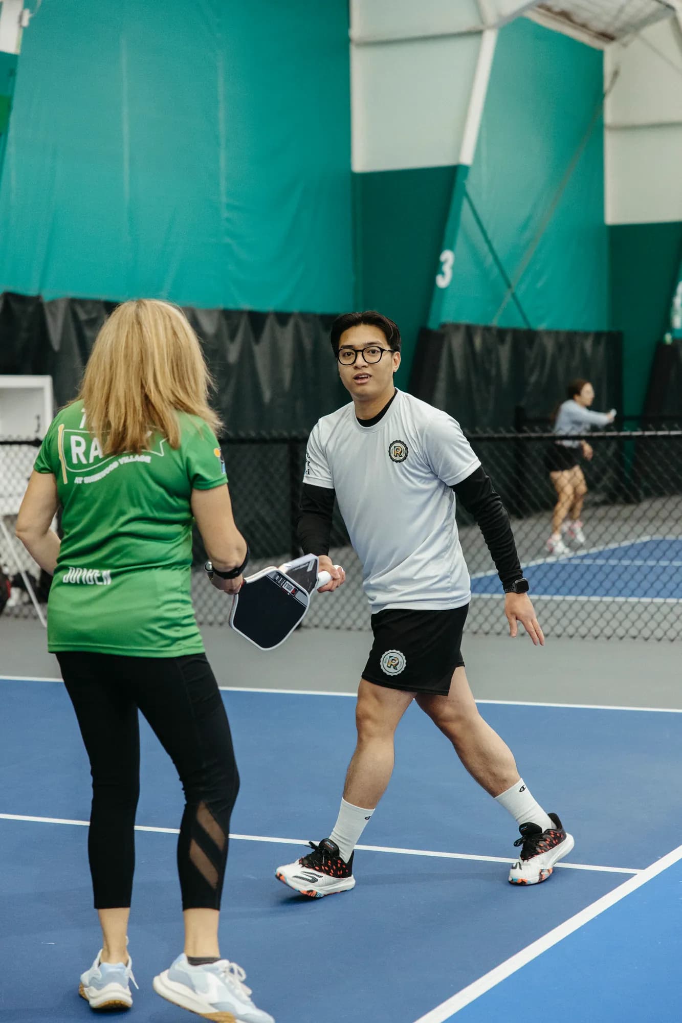 Senior female pickleball player ready to compete at a Senior Open stop
