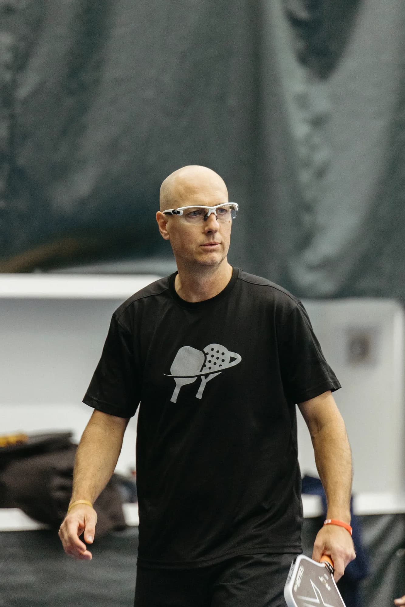 Senior male pickleball player at a Klyng Senior Open stop